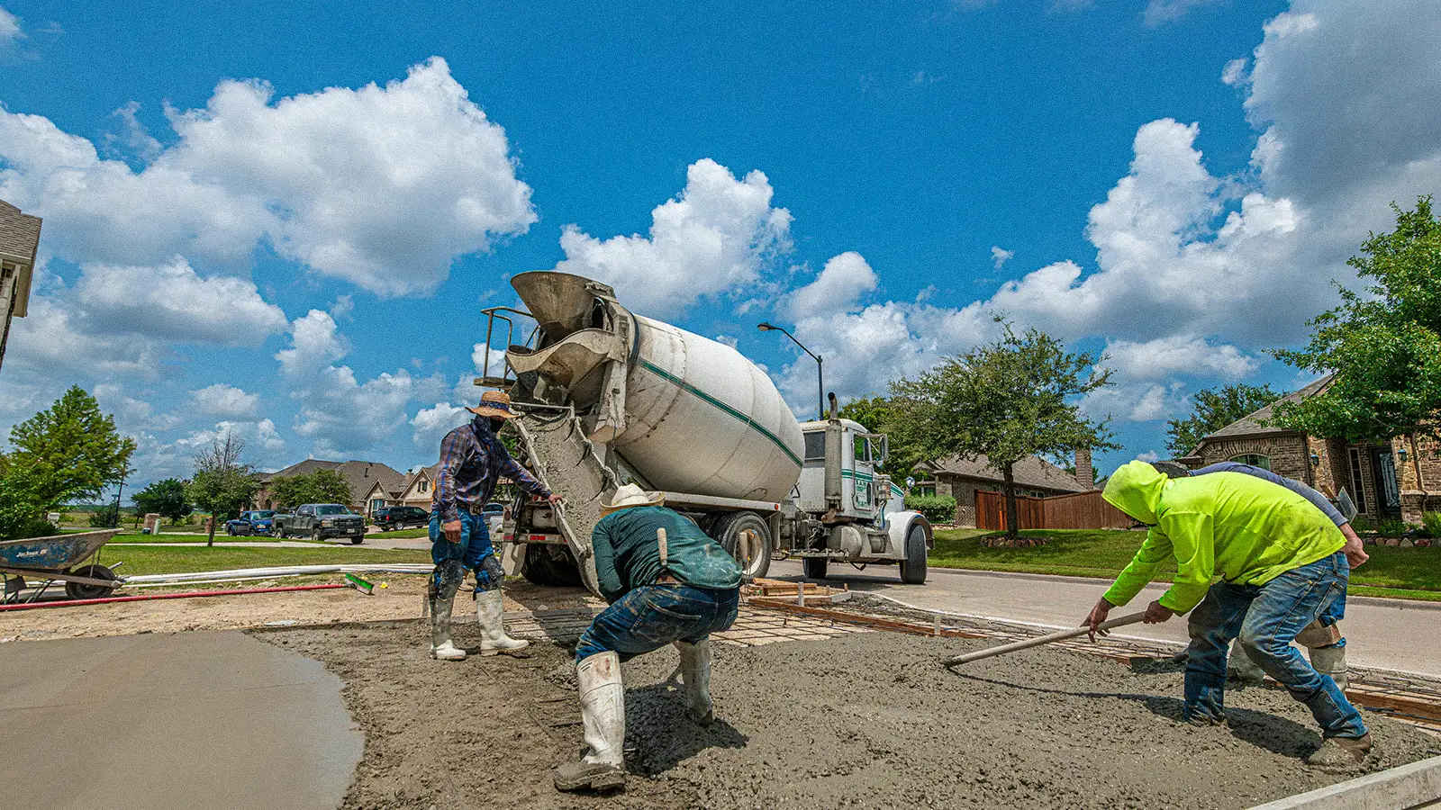 Concrete pourers pouring foundation concrete