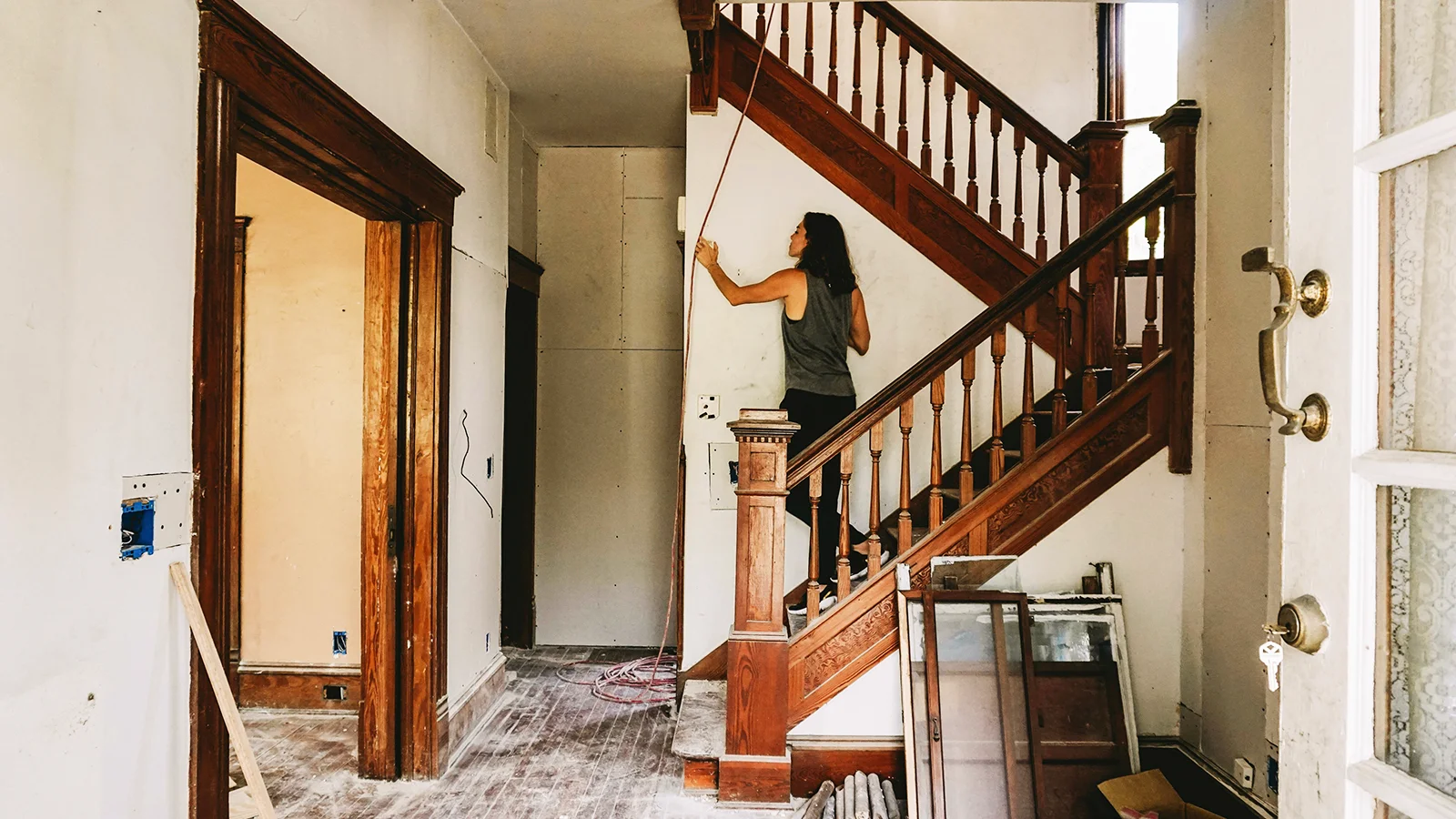 Woman on the stairs of a restoration jobsite